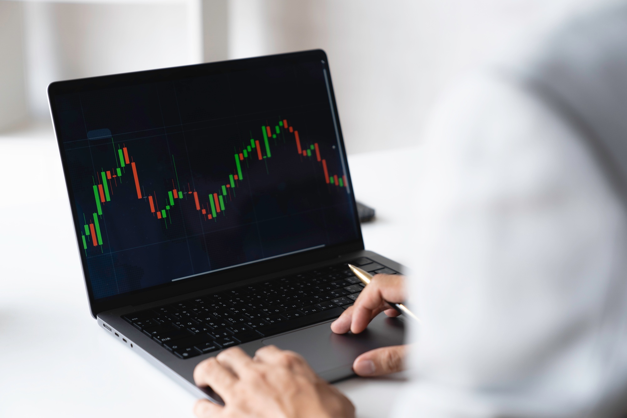 Businessman trading stocks with laptop talking about forex on laptop screens of stock market investm
